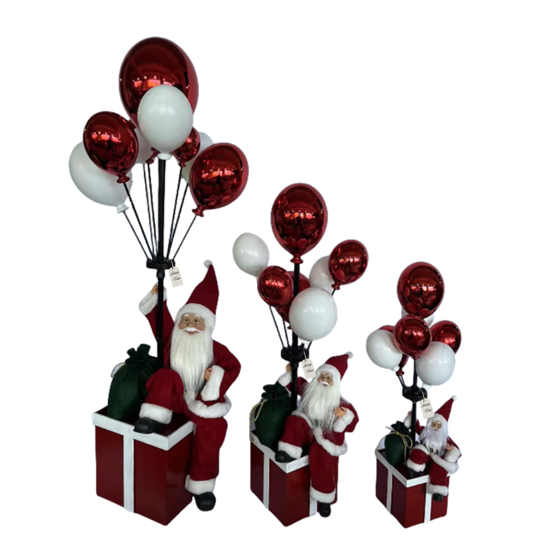 Santa Sitting on Gift Box with Balloons – Christmas Decoration Luxury Casa