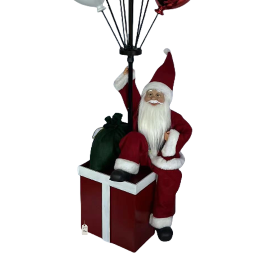 Santa Sitting on Gift Box with Balloons – Christmas Decoration Luxury Casa